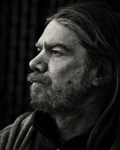Man with long hair in black and white